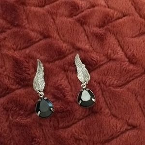 Women's oval black ear rings